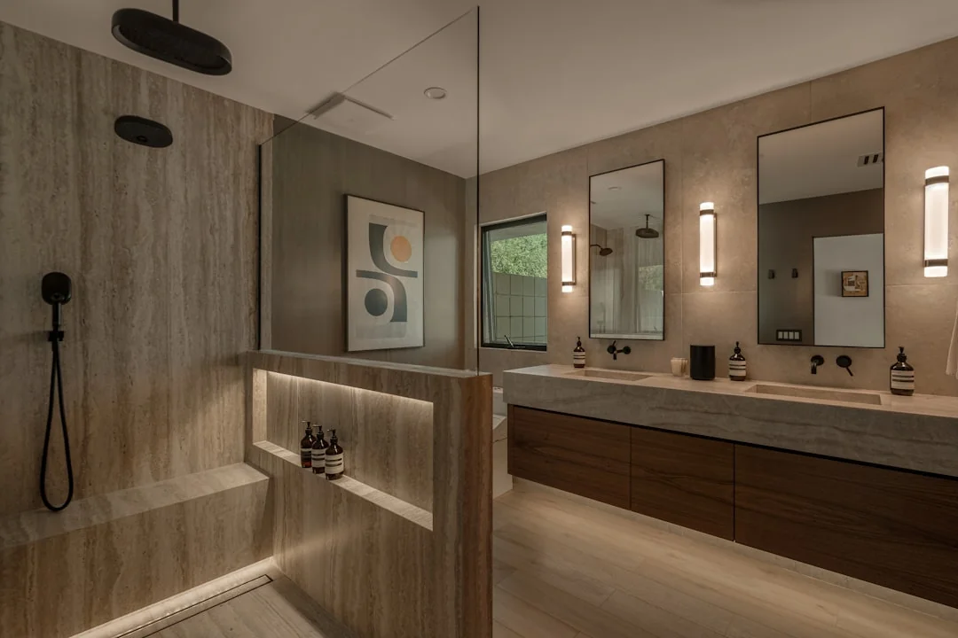 An adult man cleaning an indoor glass window, with a focus on household tasks and cleanliness.